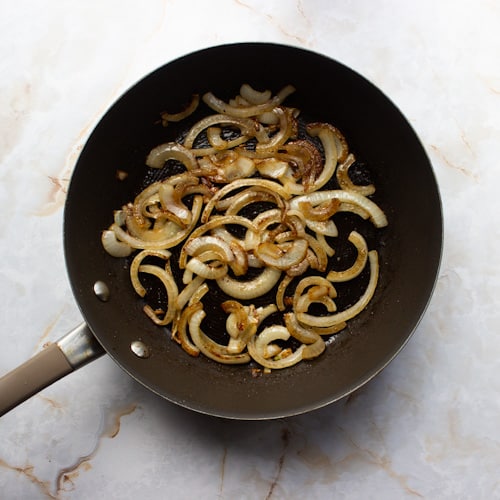 Onions caramelizing in a pan