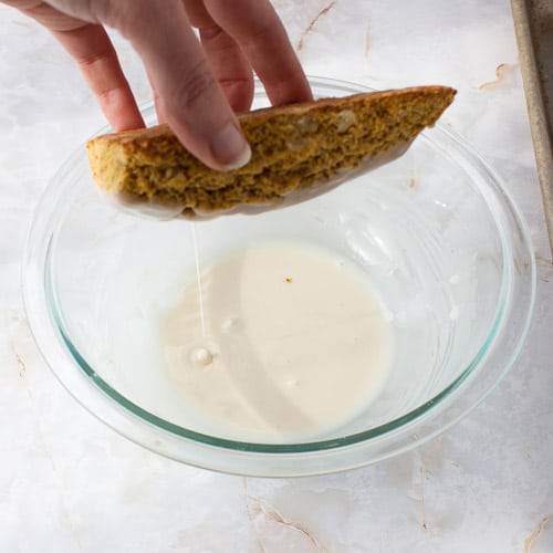 Dipping a scone into the plain glaze