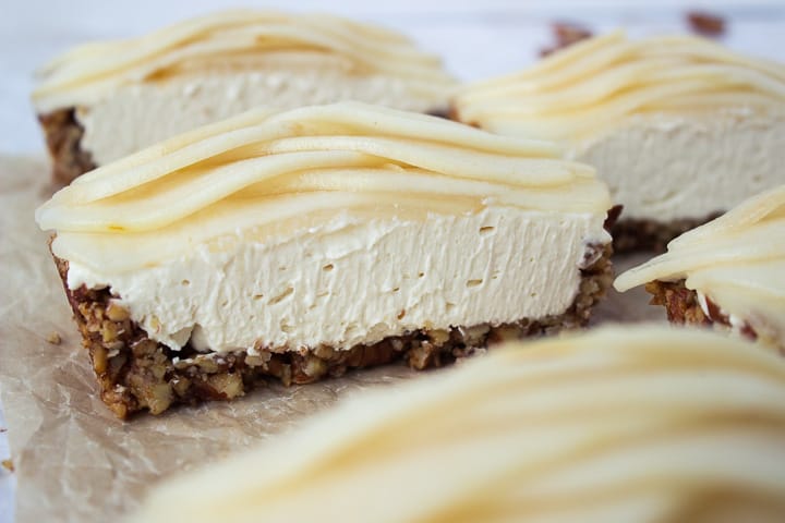 Up close picture of a cut Salted Caramel Mascarpone Pear Tart with pecan crust. 
