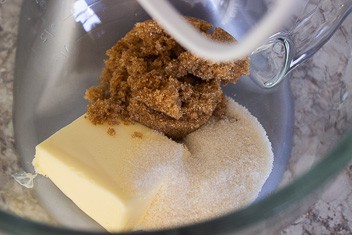 butter, brown sugar and cane sugar in mixer bowl