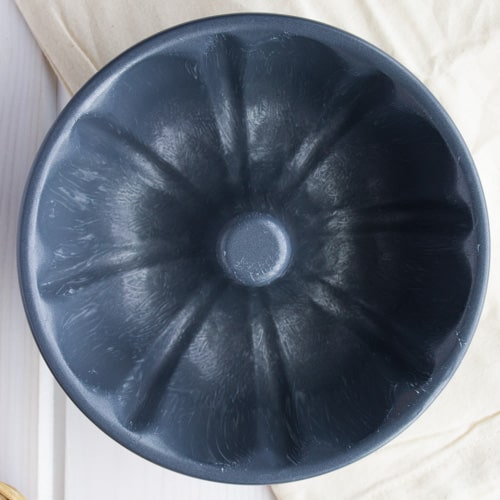 inside of a 6 inch Bundt pan coated with butter