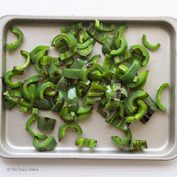 grilled and sliced jalapenos on a tray