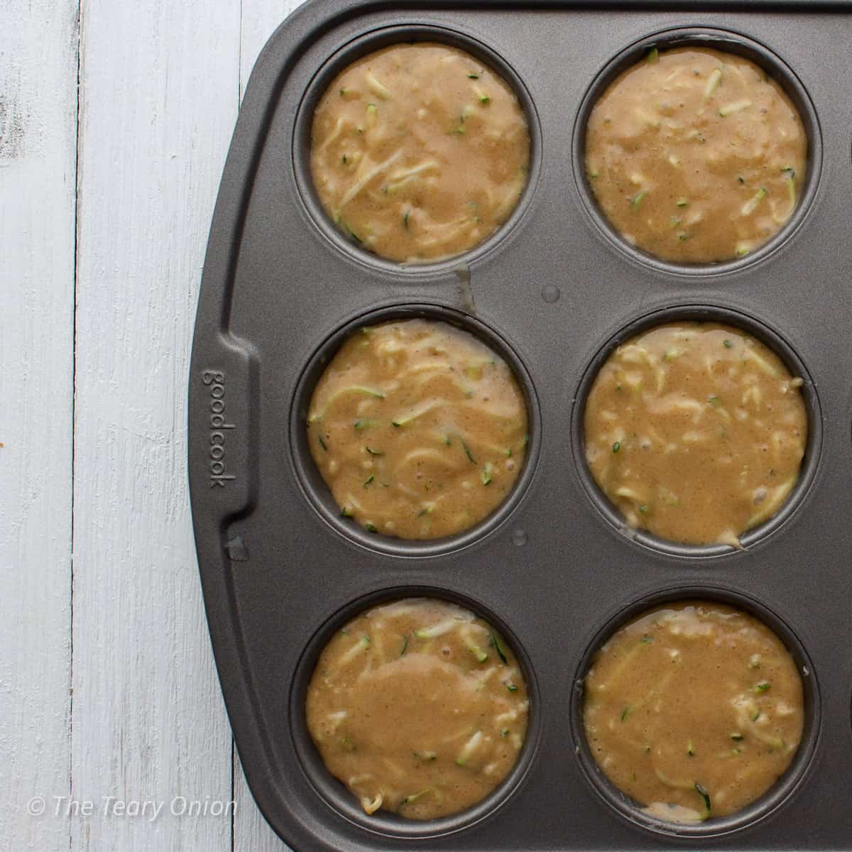 muffin batter in the muffin pan.